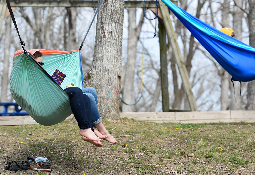 A parental aid and a resident read together